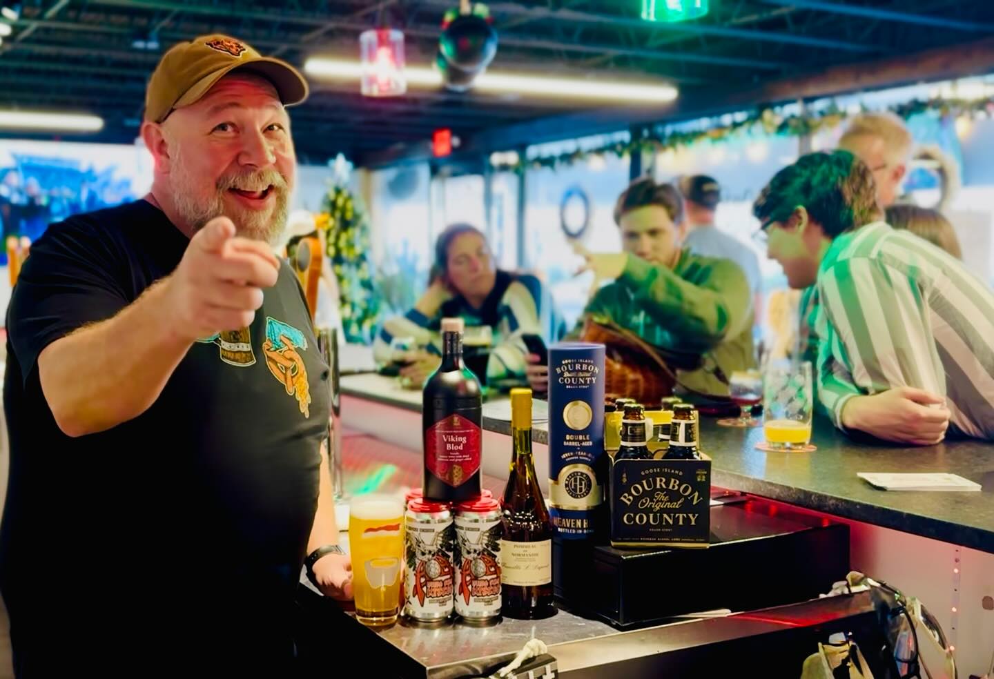 Bartender at Van Beers Bottle & Tap in Melbourne FL serving craft beer with rare bottles and rotating taps in a relaxed taproom atmosphere