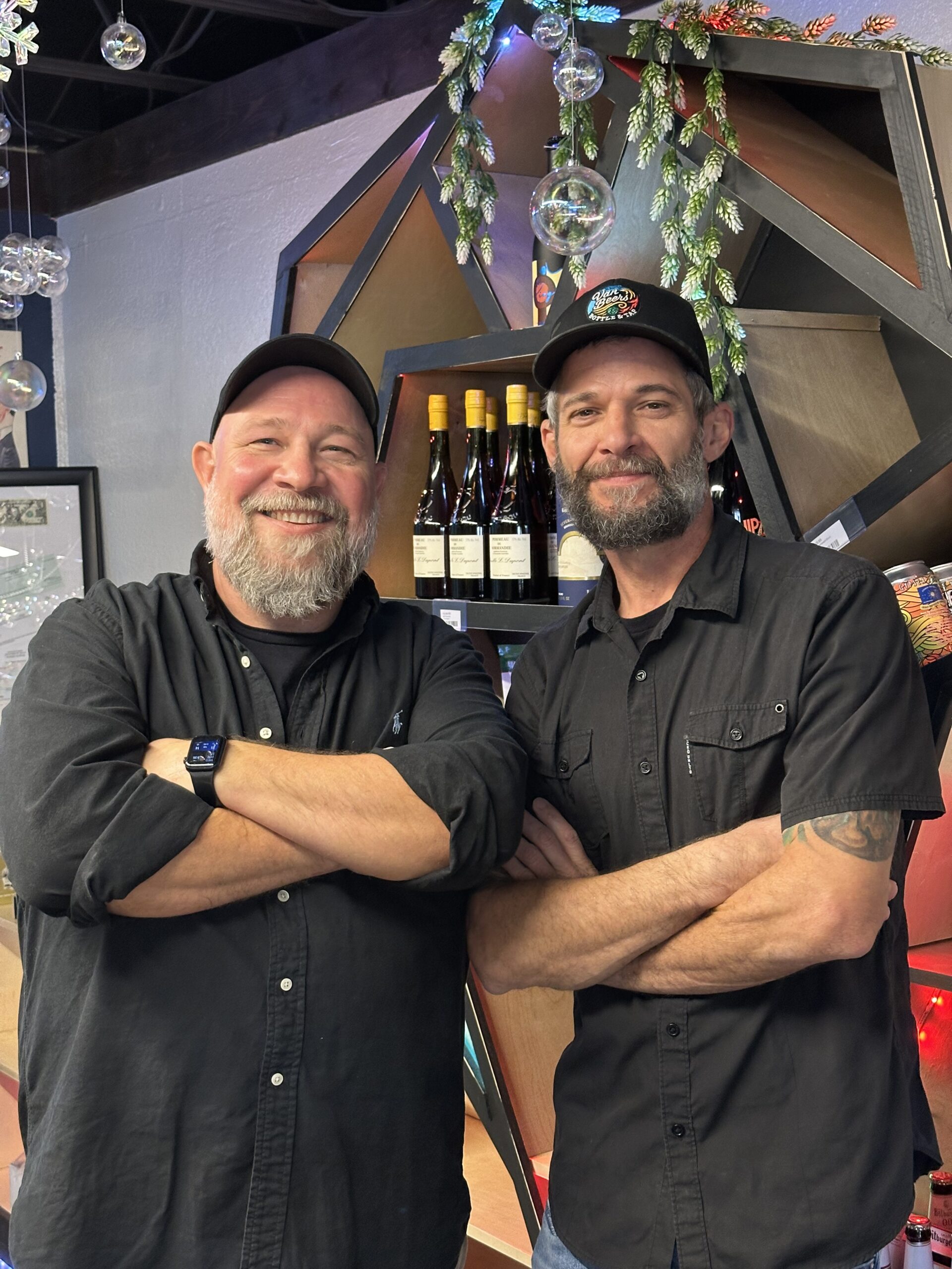Van Beers Bottle & Tap owners Jay and Glenn inside their craft beer taproom in Downtown Melbourne, Florida.