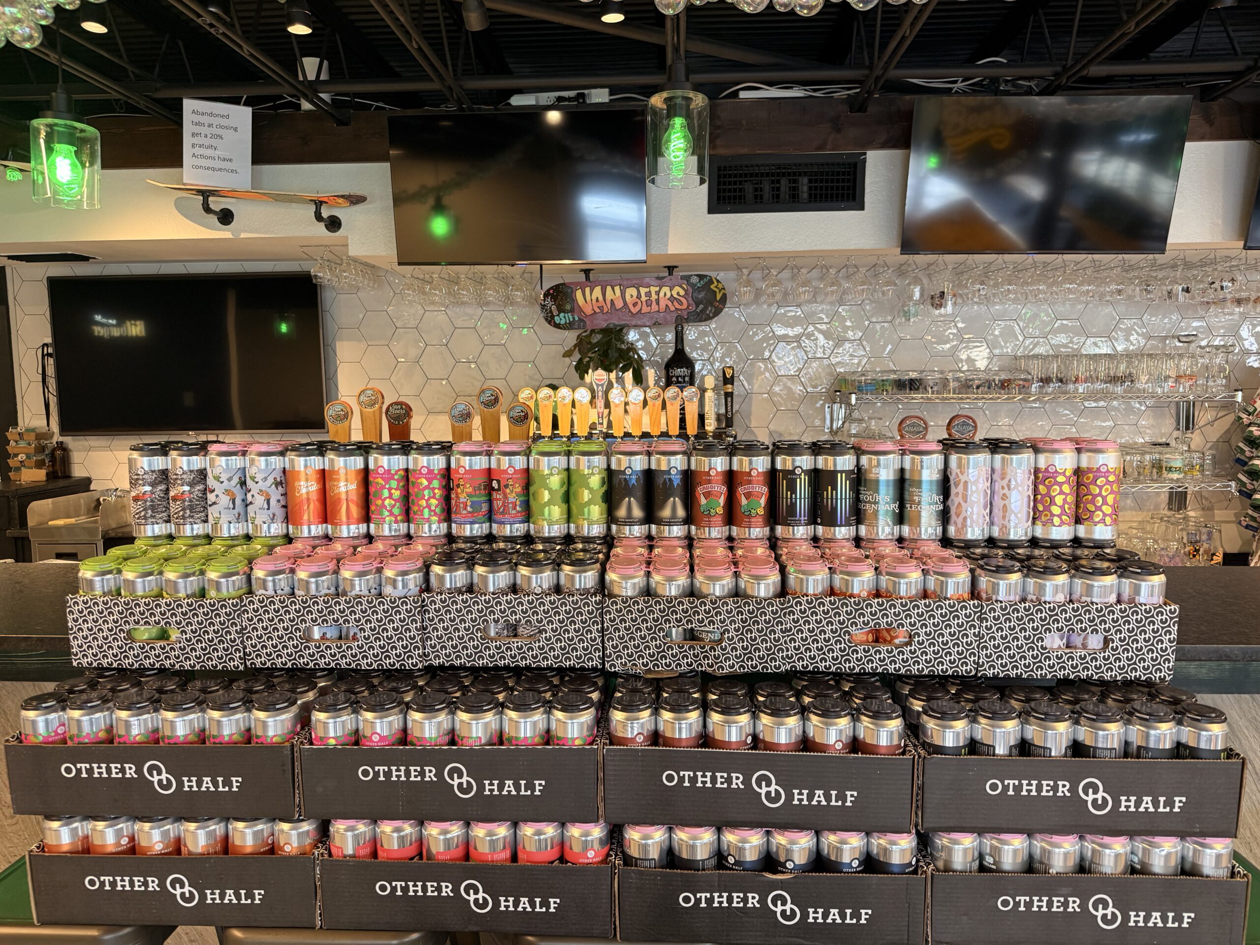 Large selection of craft beer cans and kegs displayed inside the Van Beers Bottle & Tap bottle shop in Melbourne Florida