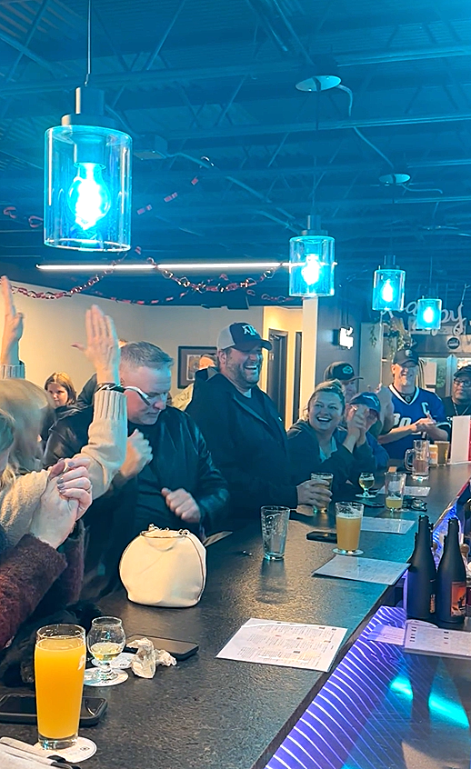 Guests enjoying craft beer and a lively taproom event at Van Beers Bottle and Tap in downtown Melbourne Florida